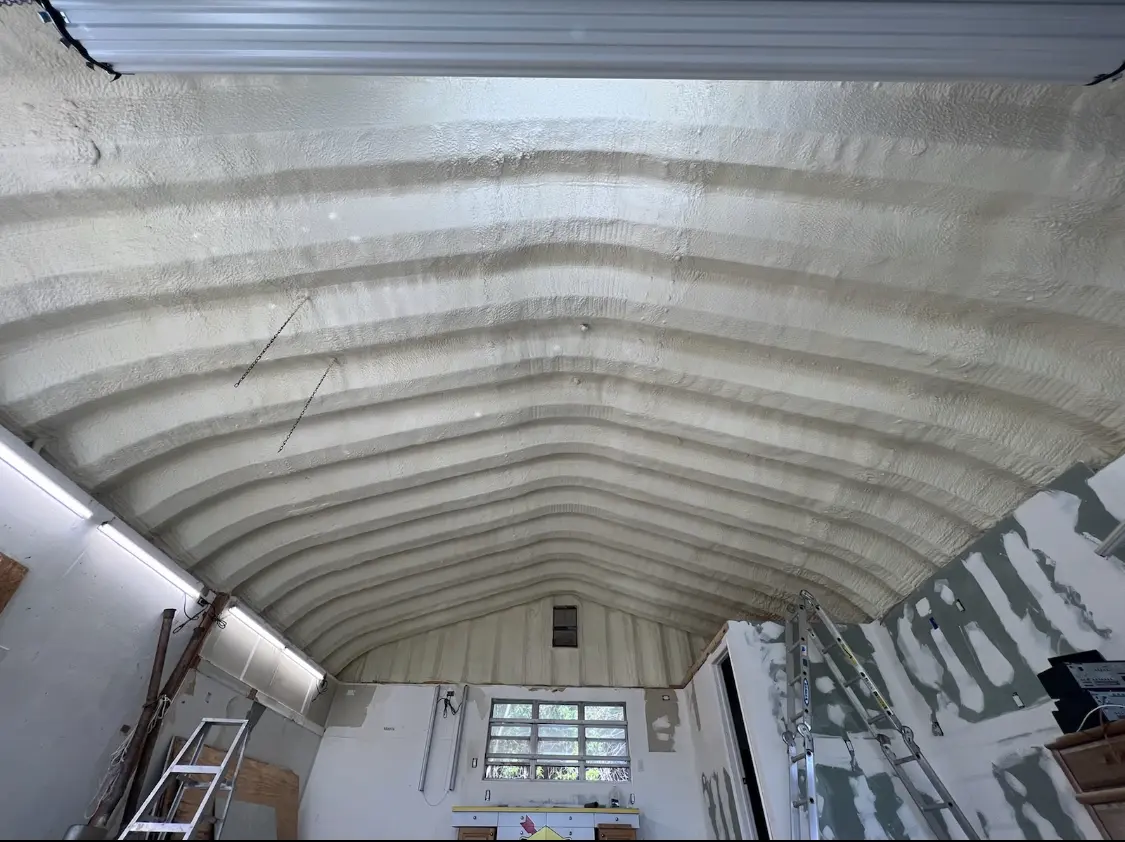 Spray polyurethane foam applied to the underside of a metal roof deck in Daleville